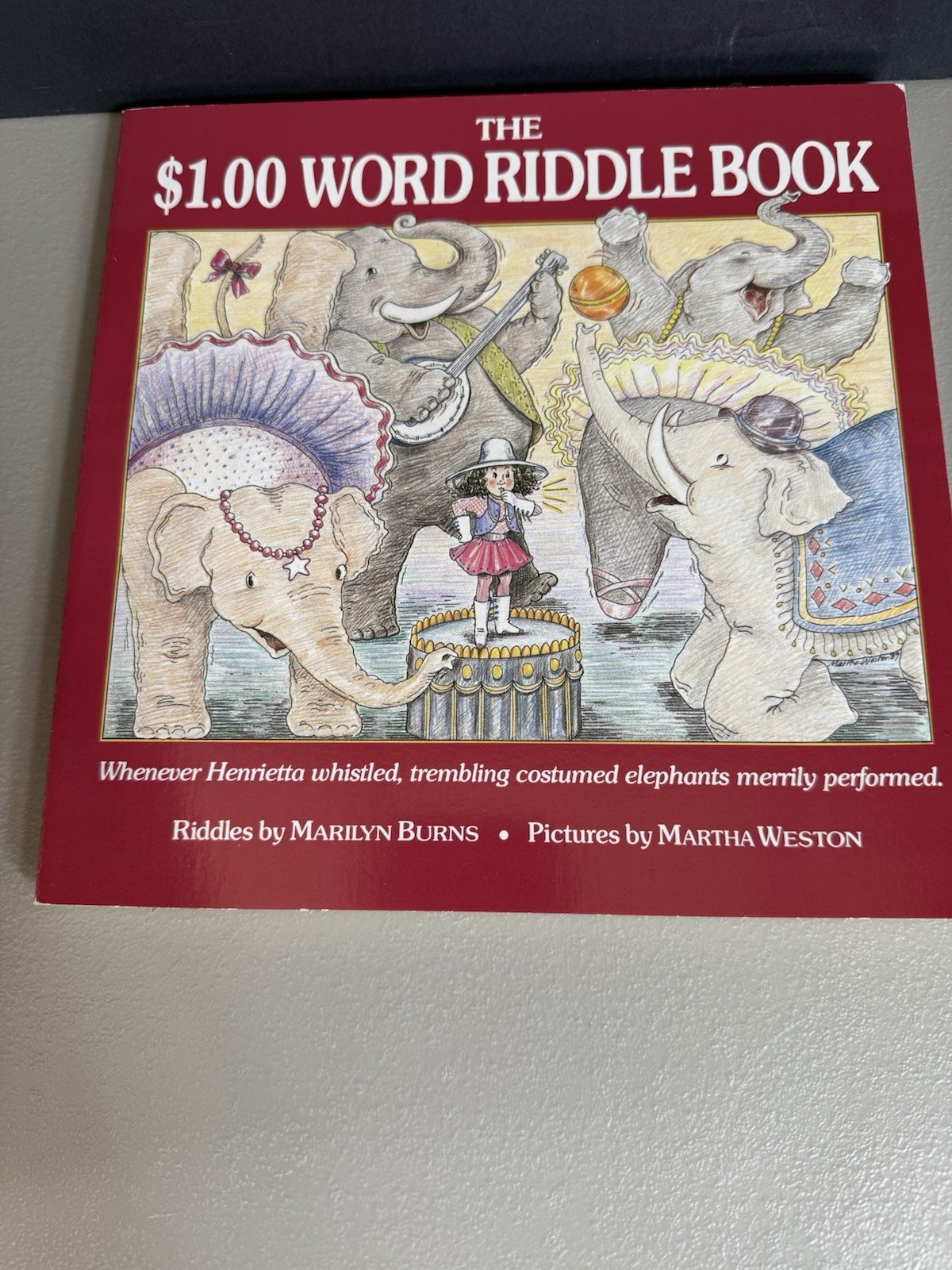 “The $1.00 Word Riddle Book” Paperback by Marilyn Burns – Fun Way to Do Math