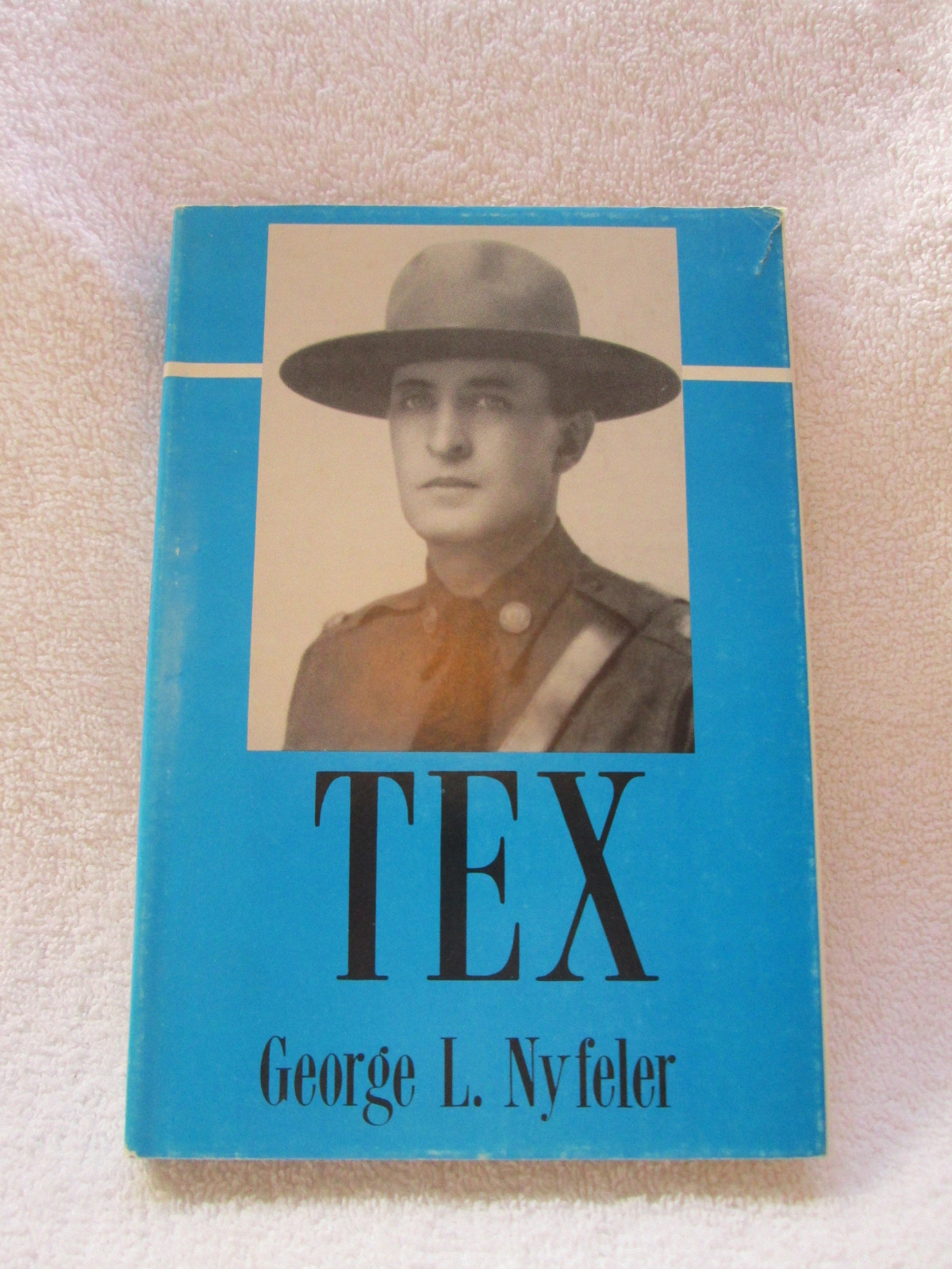 TEX by George L. Nyfeler, hardback with DJ, 98 pages, small book, 6″ by 8″ 1989