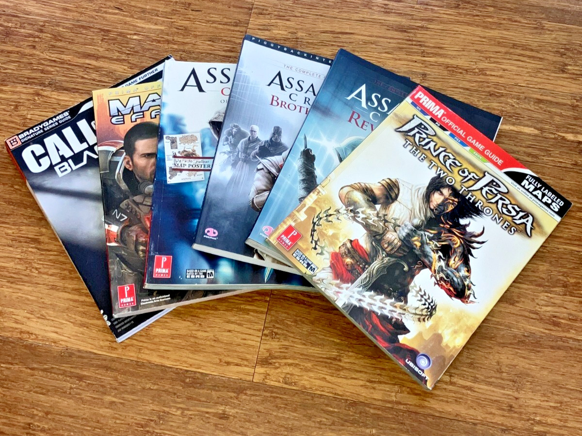 BradyGames & Prima Lot 6 Game Guides Mass Effect 2, Black Ops, Assassins Creed